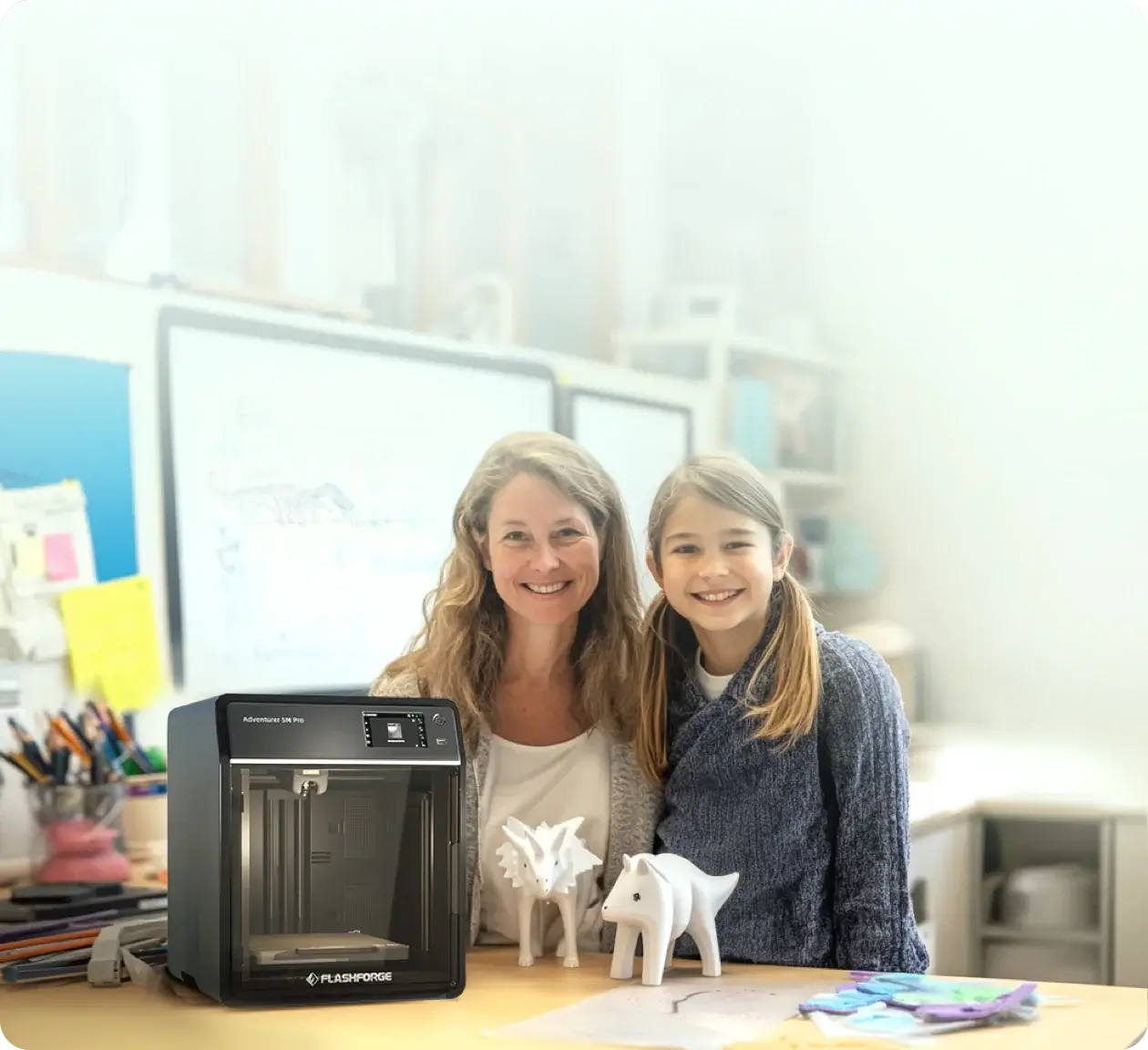 Teacher and girl using Flashforge 3D printer to create educational models in a school setting.
