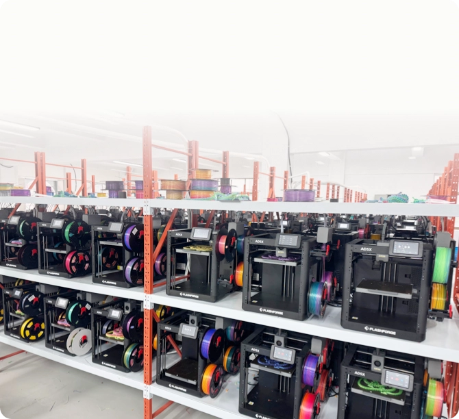 Multiple Flashforge Adventurer 5M Series printers arranged as a 3D printing farm.